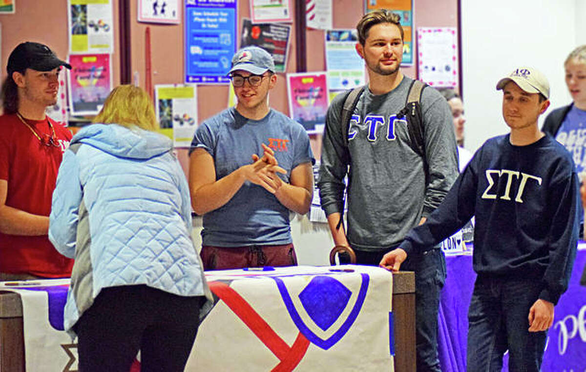 Members of the SIUE Sigma Tau Gamma chapter talk to a student who has written her name on a banner as a way to help combat nicotine addiction on Wednesday in Edwardsville. The fraternity has partnered up with the SIUE Sigma Phi Epsilon chapter to help stop those with nicotine addiction as part of their first campaign, “The No Nicotine Initiative.” President of Sigma Tau, CJ Metheny addressed the issue, “There is a growing nicotine addiction in the country and frats usually get a bad look because we usually have members who do it. So, we wanted to do this campaign as a way to change our image and hopefully our school’s image.”
