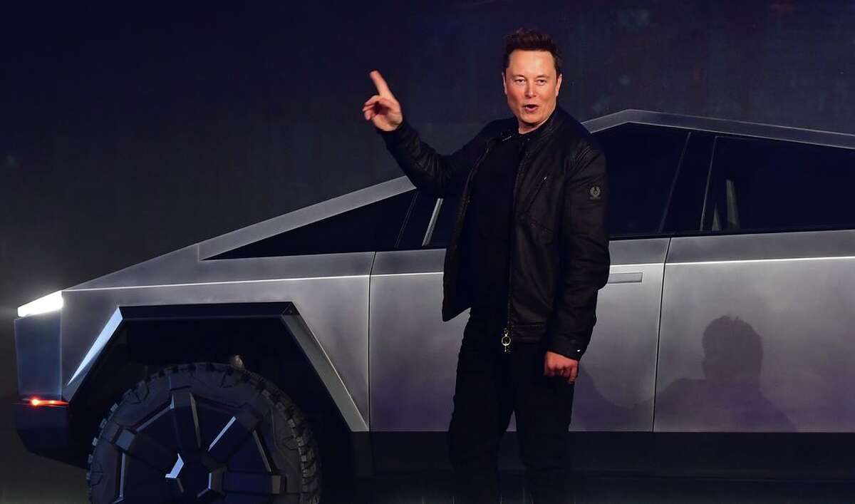 (FILES) In this file photo taken on November 21, 2019 Tesla co-founder and CEO Elon Musk gestures while introducing the newly unveiled all-electric battery-powered Tesla Cybertruck at Tesla Design Center in Hawthorne, California. - Tesla shares dived around 20 percent in early afternoon trading February 5, 2020, giving back some of the gains the electric-car maker racked up since October. Shares stood at $723.92, down 18.3 percent around 1835 GMT, reversing a nearly unbroken trend over the last four months that accelerated this week when the stock jumped more than 36 percent in a two-day surge. (Photo by Frederic J. BROWN / AFP)