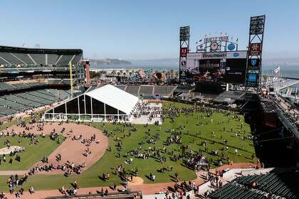 Fans are seen on the field during the San Francisco Giants Fan Fest event at Oracle Park on Saturday, Feb. 8, 2020.