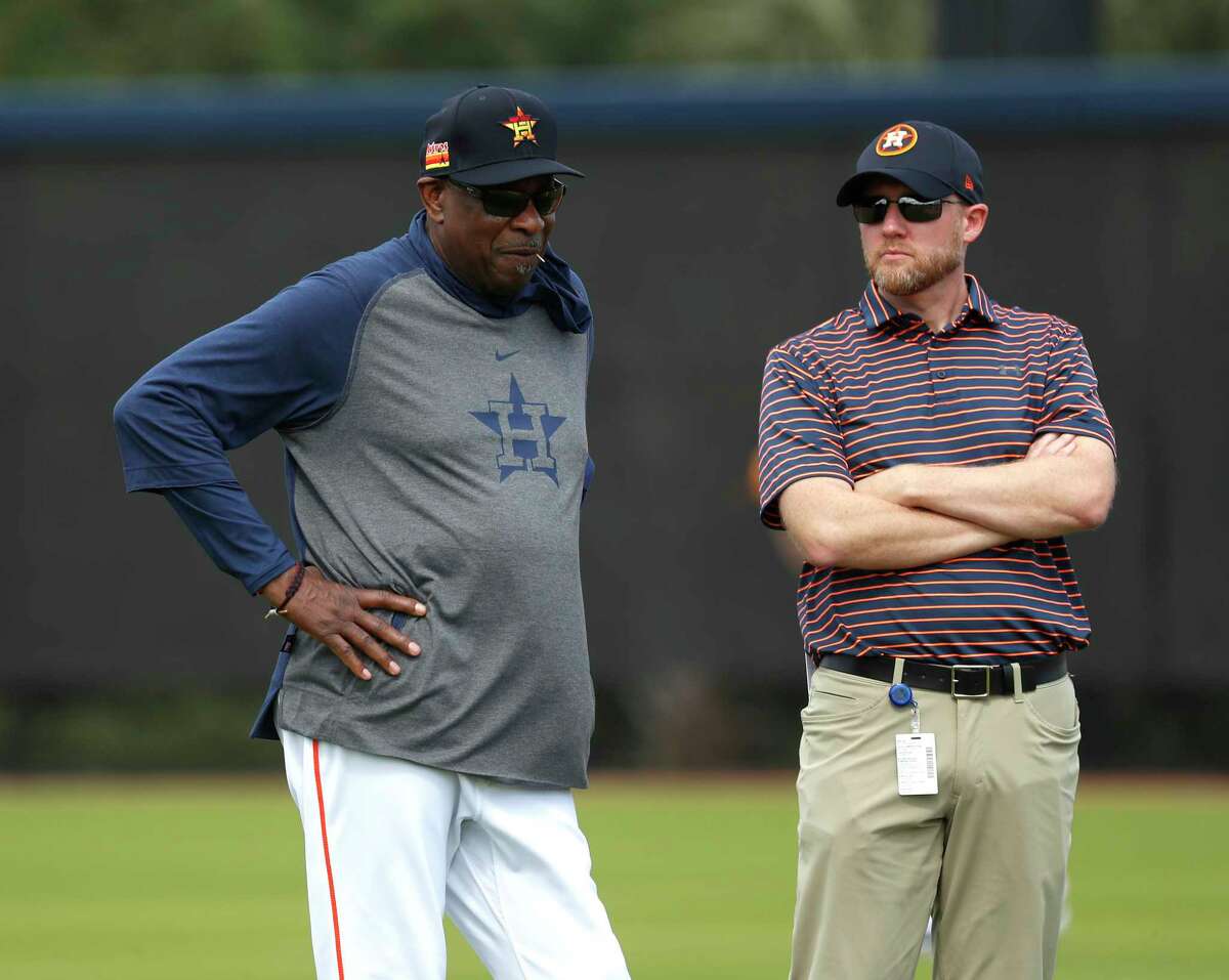 New Astros general manager James Click, right, watching spring training with Dusty Baker, has spent baseball's shutdown getting to know the baseball operations staff.