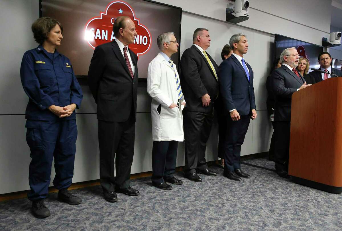 Dr. John Hellerstedt, commissioner of the Texas Department of State Health Services (at podium), joins officials from the Centers for Disease Control and Prevention and other local and health officials for a news conference regarding the state’s first case of COVID-19, or novel coronavirus, on Thursday, Feb. 13, 2020. Hellerstedt said the health system had worked “exactly as planned.”