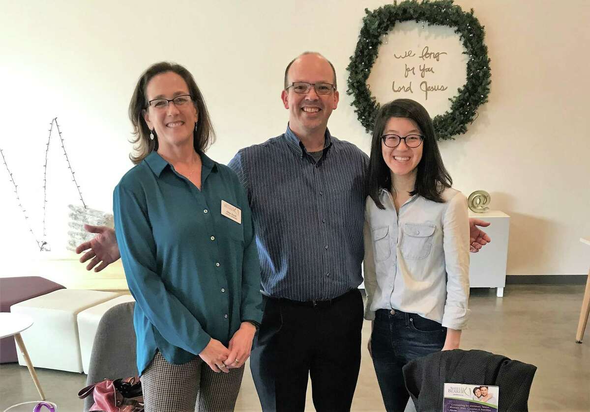Allie Scott and Thad Cardine of Shield Bearer pose for a photo with Gloria Chen of Access Church in the office of Shield Bearer's newest counseling location in Spring Branch, which opened February 2020.
