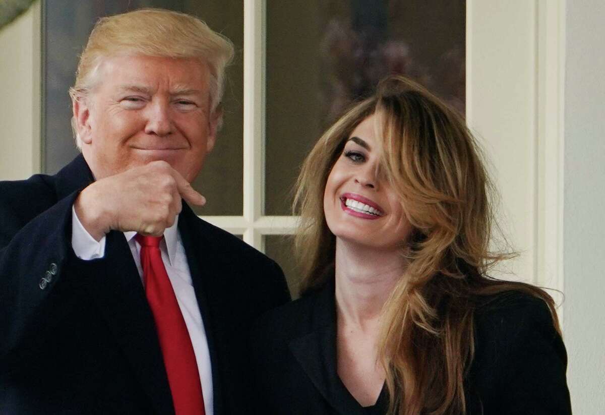 (FILES) In this file photo taken on March 29, 2018 US President Donald Trump points to former communications director Hope Hicks shortly before making his way to board Marine One on the South Lawn and departing from the White House. - The White House has told former top presidential aide Hope Hicks and another former senior staffer to not cooperate with a congressional investigation of alleged obstruction of justice by Donald Trump, a senior Democrat said on June 4, 2019. (Photo by Mandel NGAN / AFP)MANDEL NGAN/AFP/Getty Images