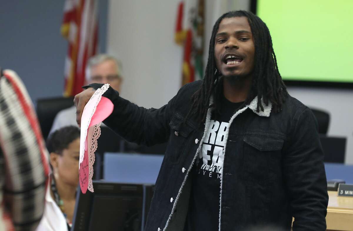 Robert Paige, 25 years old, from the Urban Peace movement recites his poem opposing a plan to spend $75 million to rebuild Camp Sweeney during a supervisor�s meeting at the Alameda County administration building on Thursday, Feb. 13, 2020, in Oakland, Calif. Paige also included a Valentine Day card to the board of supervisors saying �This is not what love looks like�.