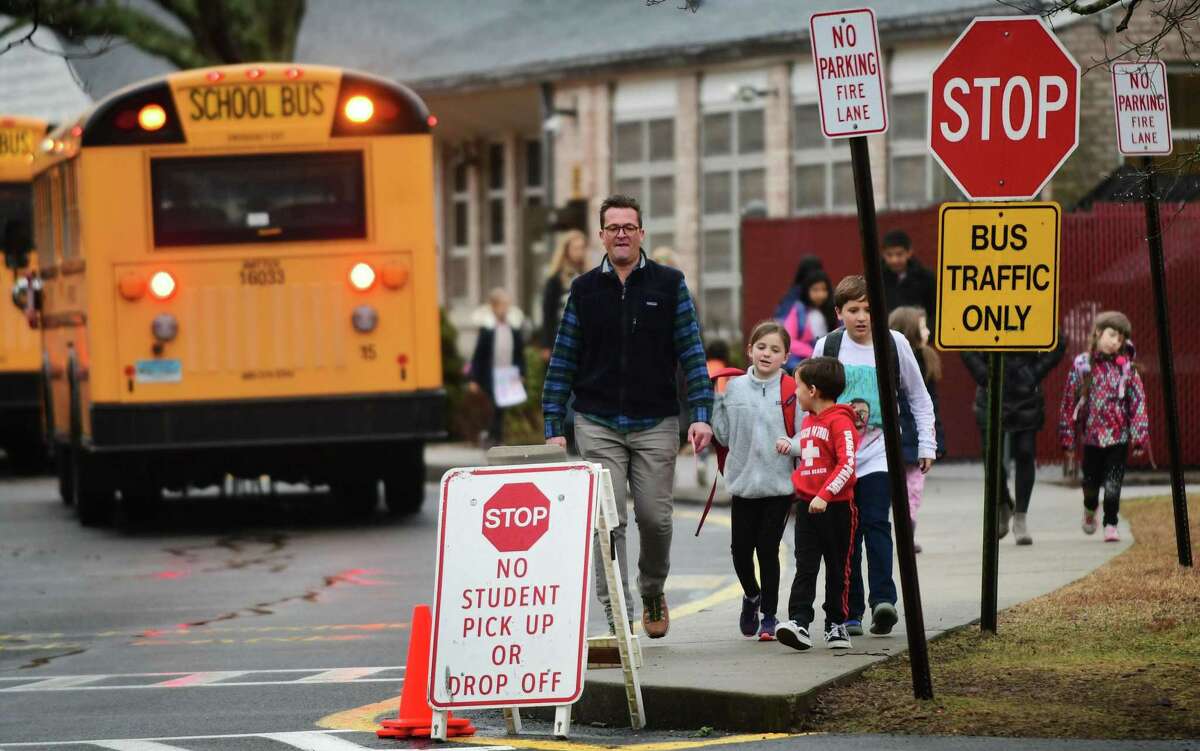 Students leave Coleytown Elementary School in Westport on Thursday.