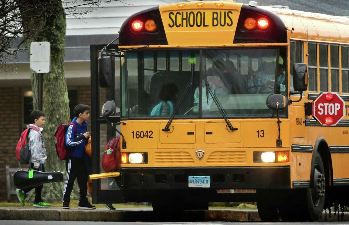 Students leave Coleytown Elementary School Thursday, February 13, 2020, in Westport, Conn. The Westport Board of Education is considering a three-year action plan to address disparities within the district.