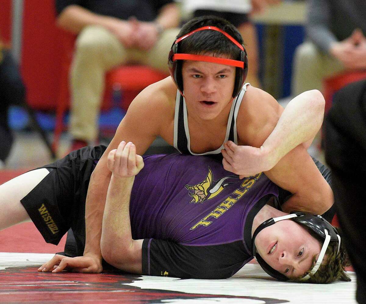 Greenwich’s Carlos DeWinter controls Westhill’s John Leydon in a 120-pound bout during a match on Jan. 8 in Greenwich.