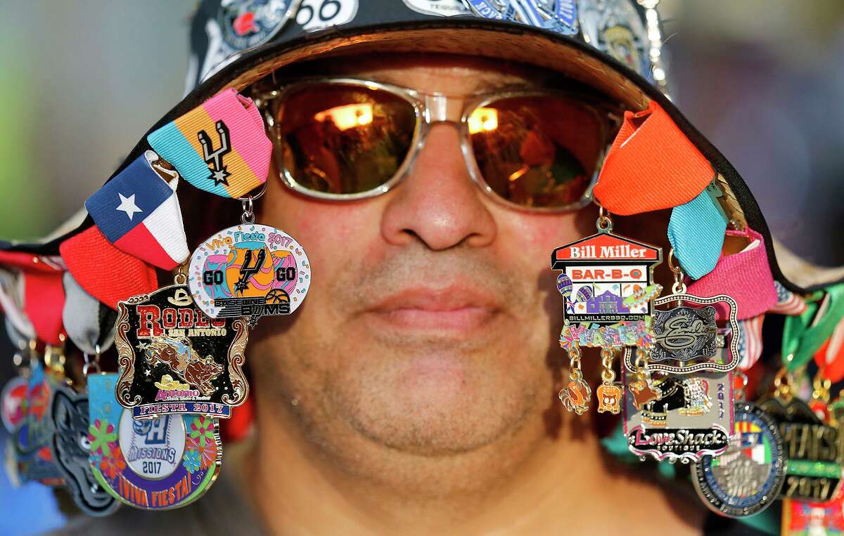 Arnold Salas wears medals on his hat during the Fiesta Fiesta event in 2017 at Hemisfair.