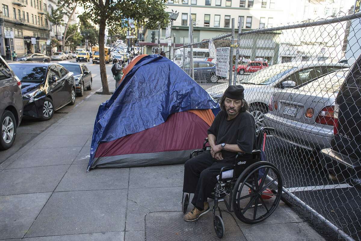 Michael Hwang, 67, sits in his wheel chair next to the parking lot at Jones and Turk Streets on Wednesday, Jan. 22, 2020 in San Francisco, Calif. The city of San Francisco rejected a proposal to build tiny units for the homeless on a parking lot at 180 Jones Street.