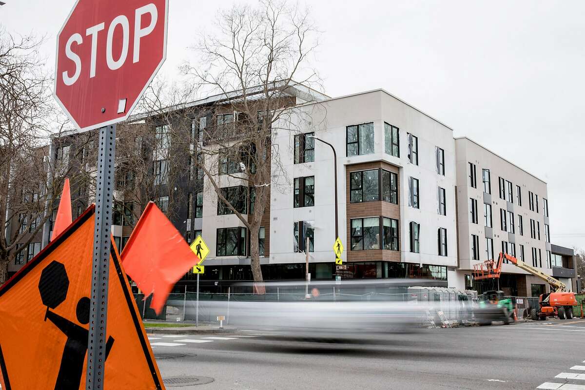 A large mixed-use complex in its final stages of construction is seen on the corner of San Pablo Avenue and Jones Street in Berkeley, Calif. Thursday, February 13, 2020. Berkeley, a city long resistant to housing, is now home to a building boom, and with lots more on the way if economics allow.