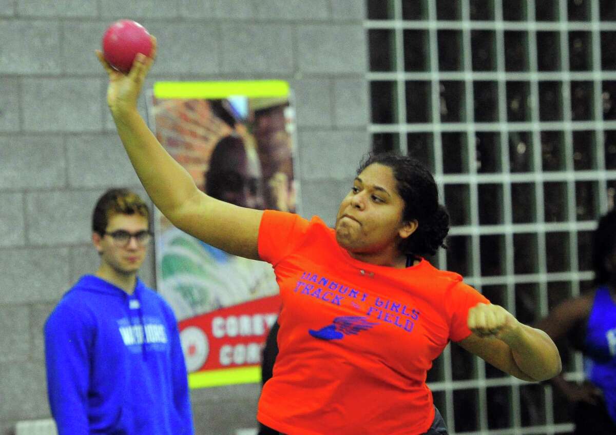 Danbury’s Alexis Chikezie competes in the shot put event during CIAC Class LL Track Championship action in New Haven, Conn., on Thursday Feb. 13, 2020.