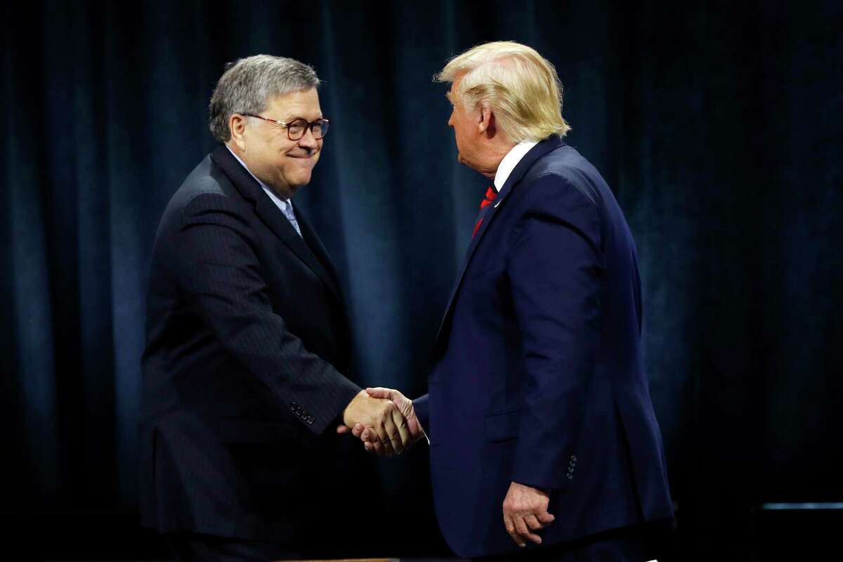 FILE - In this Oct. 28, 2019, file photo, President Donald Trump shakes hands with Attorney General William Barr before Trump signed an executive order creating a commission to study law enforcement and justice at the International Association of Chiefs of Police Convention in Chicago. Attorney General William Barr took a public swipe Thursday at President Donald Trump, saying that the presidentas tweets about Justice Department prosecutors and cases amake it impossible for me to do my job.a Barr made the comment during an interview with ABC News just days after the Justice Department overruled its own prosecutors. they had initially recommended in a court filing that President Donald Trumpas longtime ally and confidant Roger Stone be sentenced to 7 to 9 years in prison. But the next day, the Justice Department took the extraordinary step of lowering the amount of prison time it would seek for Stone. (AP Photo/Charles Rex Arbogast, File)