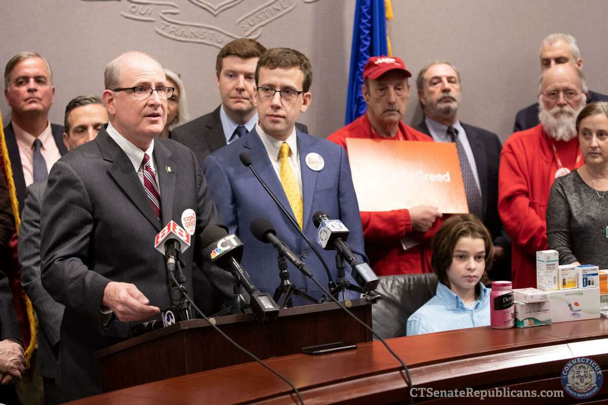 State Sen. Kevin Kelly, state Rep. Sean Scanlon and state Sen. Matt Lesser join with advocates and members of AARP at a press conference on Feb. 13 at the Connecticut Legislative Office Building to share Insurance Committee plans to cap insulin co-pays.