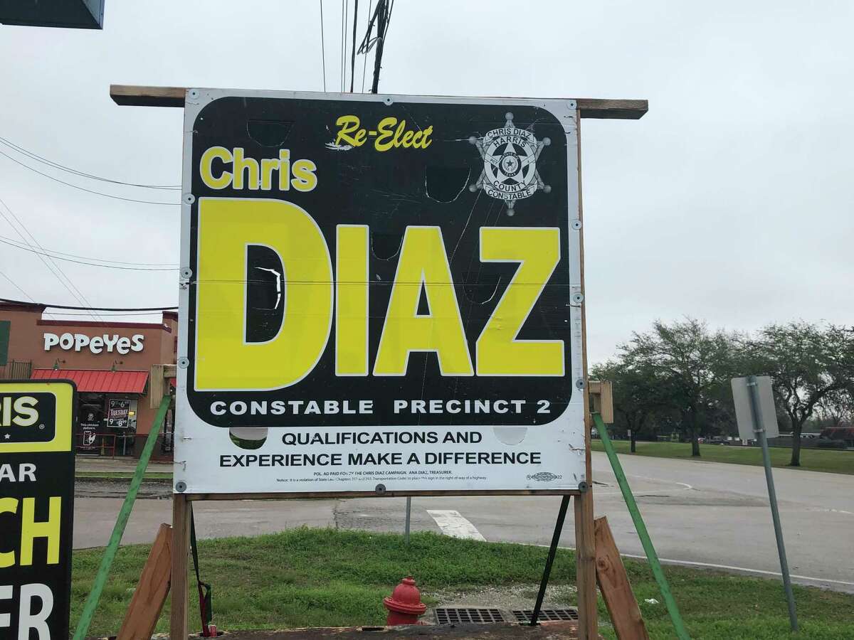 A sign in Jacinto City urges voters to re-elect Harris County Precinct 2 Constable Chris Diaz. More than a dozen current and former Precinct 2 employees say Diaz pressured them to contribute to his re-election campaigns.