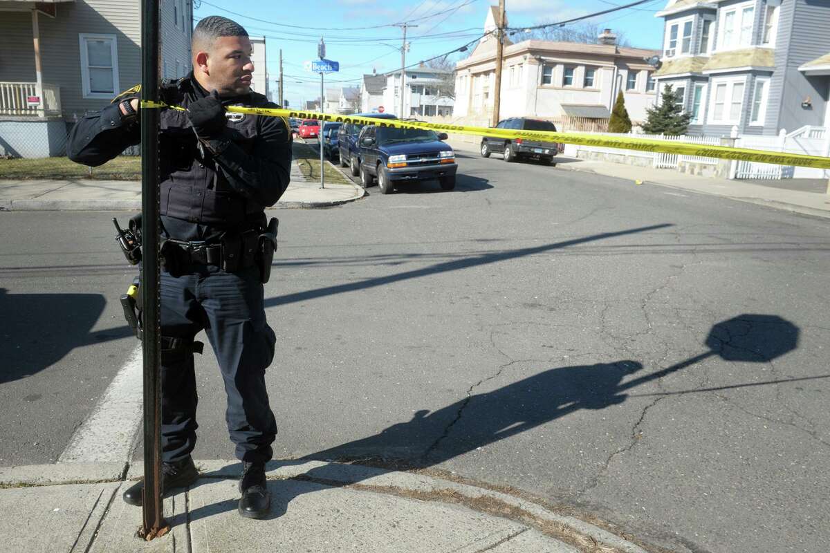 Bridgeport Police investigate the scene around the intersection of Kossuth and Jane Streets where a man was shot to death in Bridgeport, Conn. Feb. 14, 2020.