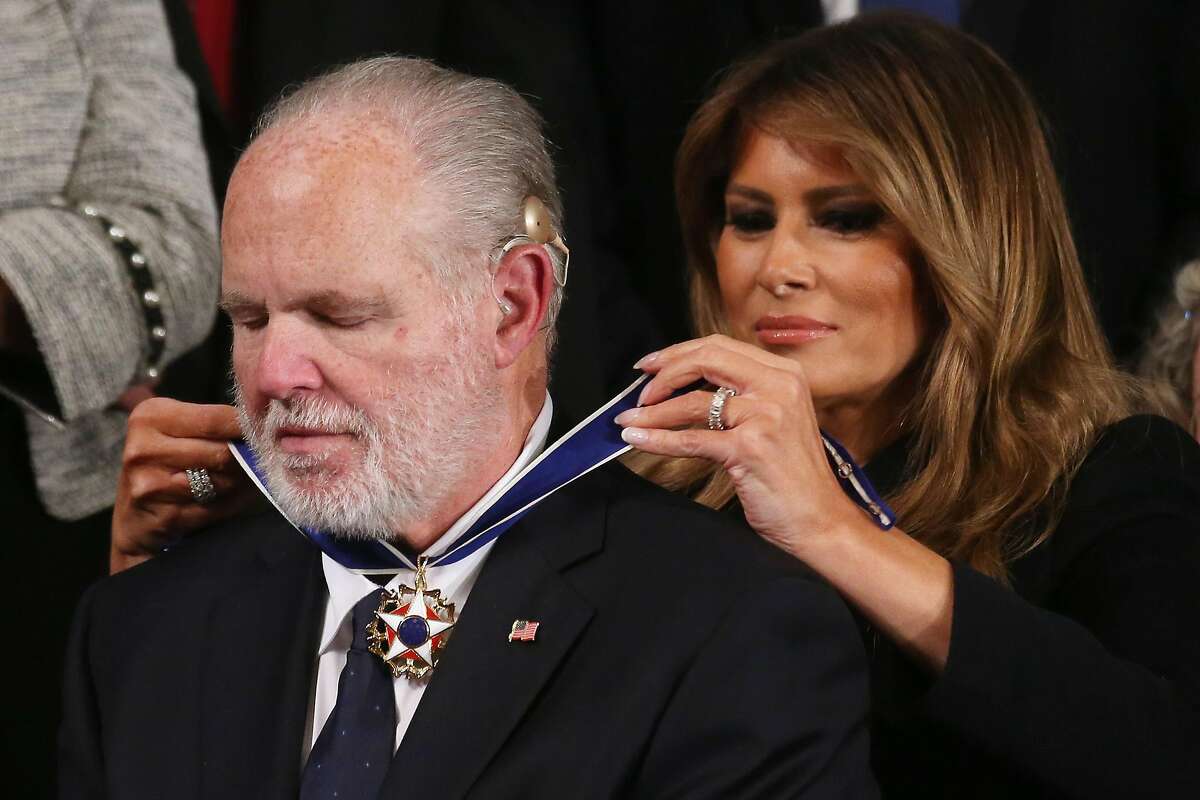 WASHINGTON, DC - FEBRUARY 04: Radio personality Rush Limbaugh reacts as First Lady Melania Trump gives him the Presidential Medal of Freedom during the State of the Union address in the chamber of the U.S. House of Representatives on February 04, 2020 in Washington, DC. President Trump delivers his third State of the Union to the nation the night before the U.S. Senate is set to vote in his impeachment trial. (Photo by Mario Tama/Getty Images) *** BESTPIX ***