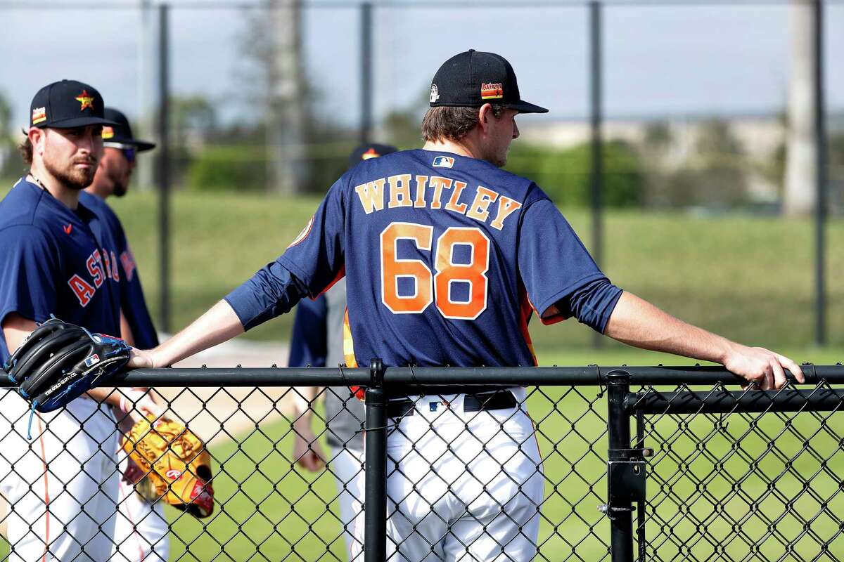 Houston Astros pitcher Forrest Whitley (68) leans against a fence during the second day of the Houston Astros spring training workouts at the Fitteam Ballpark of The Palm Beaches, in West Palm Beach , Friday, Feb. 14, 2020.