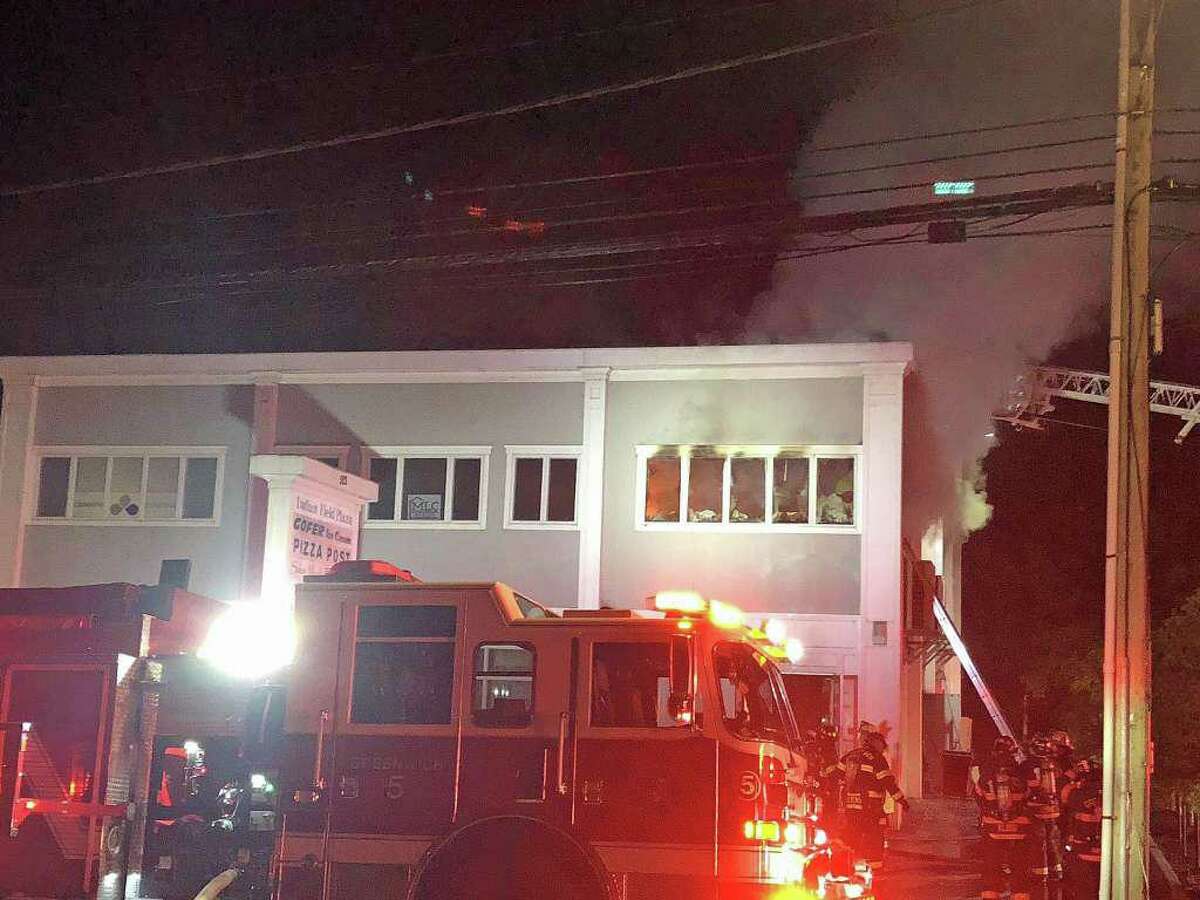 A fire heavily damaged a two-story commercial building at Indian Field Plaza on East Putnam Avenue late Monday night on Oct. 21, 2019. The fire broke out around 11 p.m. at the plaza in Cos Cob. The building houses Pizza Post, Gofer Ice Cream, a salon and nail boutique. Deputy Fire Chief Brian Koczak said there was heavy damage to the first and second floors and smoke damage to the entire building.