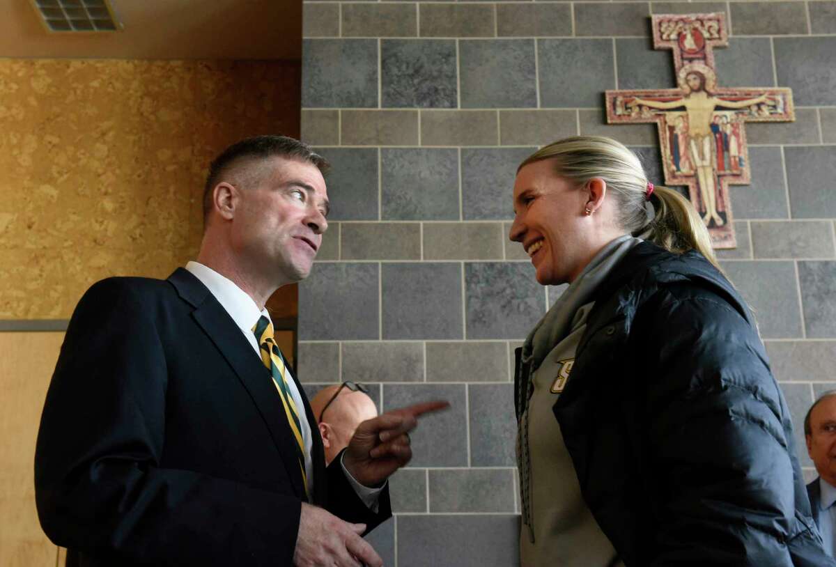 Former U.S. Rep. Chris Gibson talks Siena women's basketball coach Ali Jaques after Siena College announced him as its 12th president at Siena College on Friday, Feb. 14, 2020 in Loudonville, N.Y. Gibson, Ph.D, graduated from Siena in the class of '86. (Lori Van Buren/Times Union)