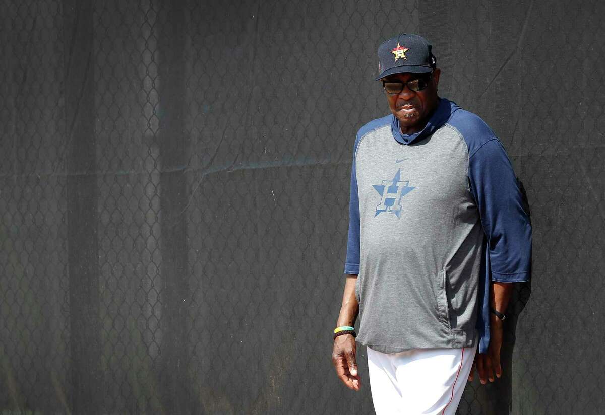 Houston Astros manager Dusty Baker Jr. watches pitchers throw off the mound during the second day of the Houston Astros spring training workouts at the Fitteam Ballpark of The Palm Beaches, in West Palm Beach , Friday, Feb. 14, 2020.