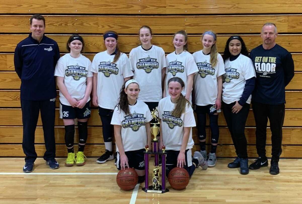 The Milford Knights 8th grade girls travel basketball team won its regular season and tournament title. Team members (front row) Maya Pinto and Abby Savoie; (second row) coach Trevor Doyle, Zoe Johnson, Erin Donegan, Chloe Haasch, Maggie Wetmore, Faith Doyle, Tiffany Rosado and coach Mike Donegan.
