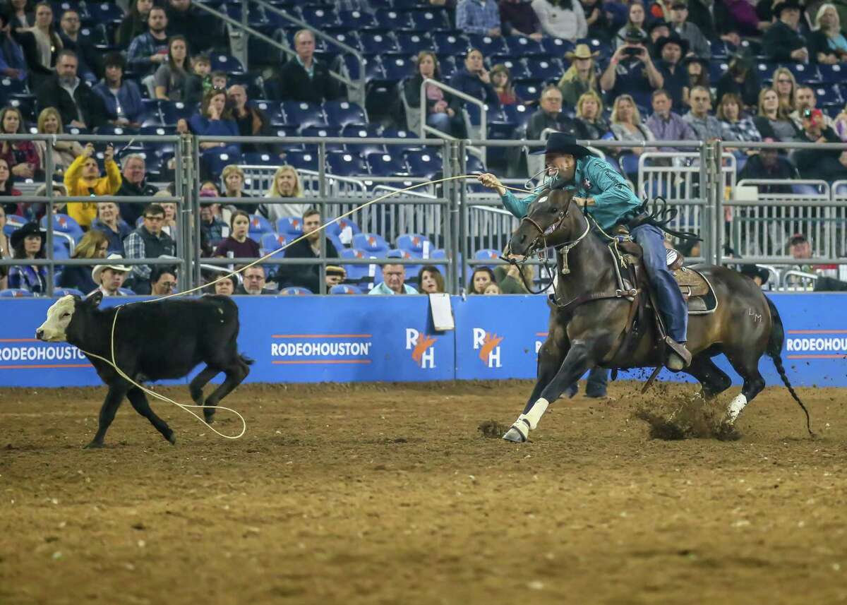 Tuf Cooper completes in the Tie-Down Roping event during the Rodeo Championship finals of the Houston Rodeo at NRG Stadium in Houston, Texas.