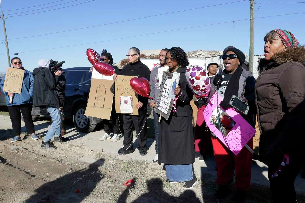 Protesters hold signs as they demonstrate roadside against Union Pacific at the rail yard affected by the creosote contamination in the 7500 block of Liberty Road Friday, Feb. 14, 2020 about five miles east of downtown in Houston, TX.