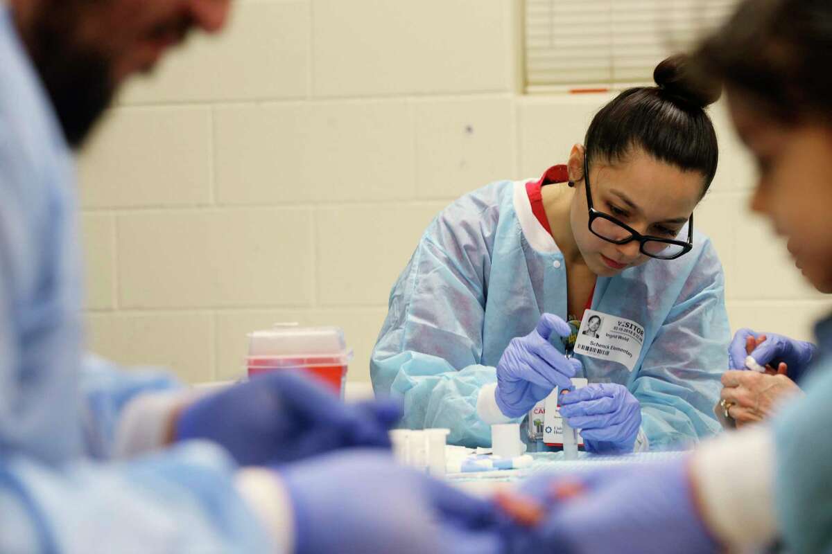 University of the Incarnate Word senior nursing student Ingrid Wold collects blood samples at the Kate Schenck Elementary School Head Start Program in this 2018 file photo. UIW is accepting applicants for a new hybrid bachelor’s degree program that allows students to earn a nursing degree in as little as 16 months.