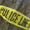Police tape is seen wrapped around a power pole. File photo