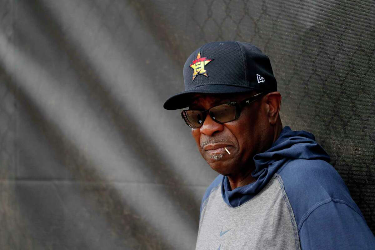 Houston Astros manager Dusty Baker leans against at fence during spring training baseball practice Thursday, Feb. 13, 2020, in West Palm Beach, Fla. (AP Photo/Jeff Roberson)