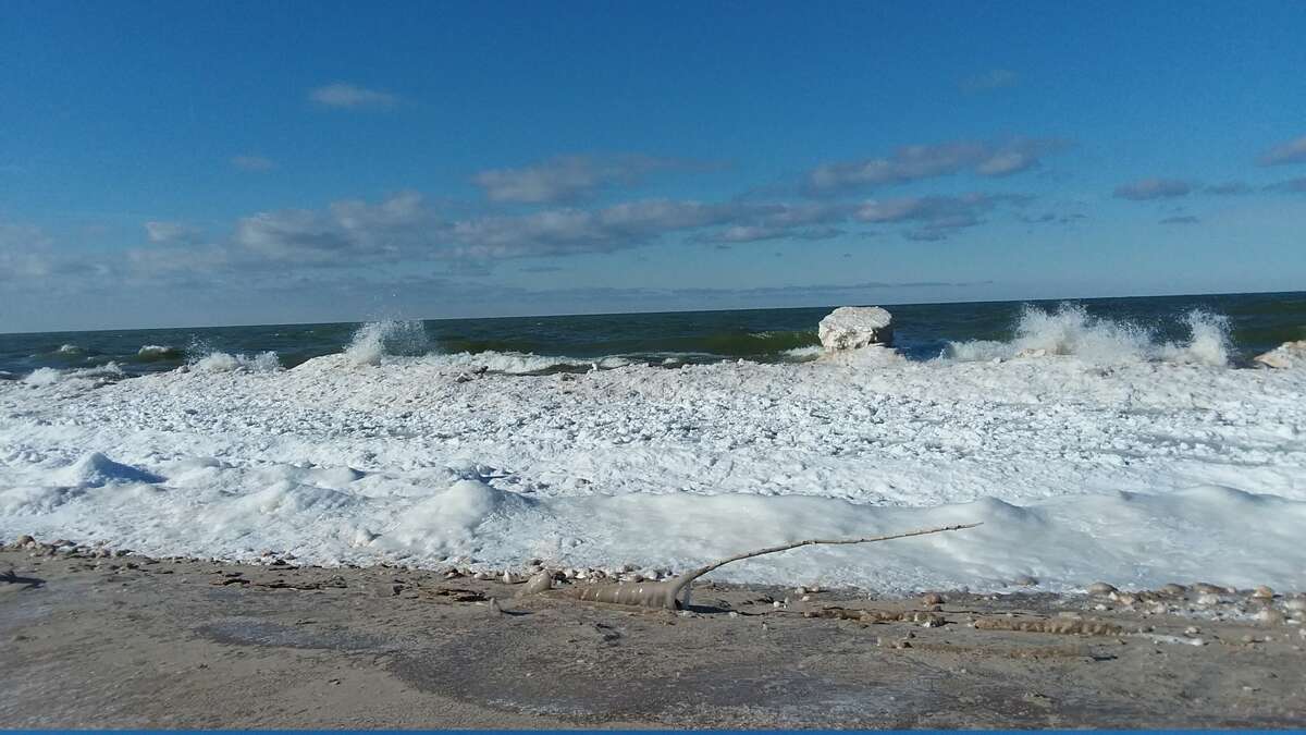 The waves were pounding the shore at First Street Beach in Manistee on Sunday morning.
