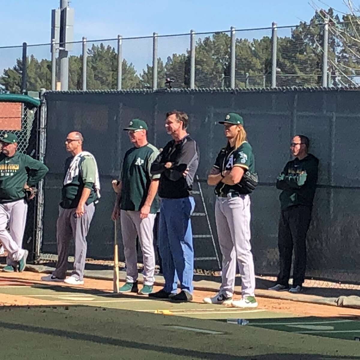 A's manager Bob Melvin, Hall of Famer Randy Johnson and Oakland starter A.J. Puk chatted during Sunday's workout.