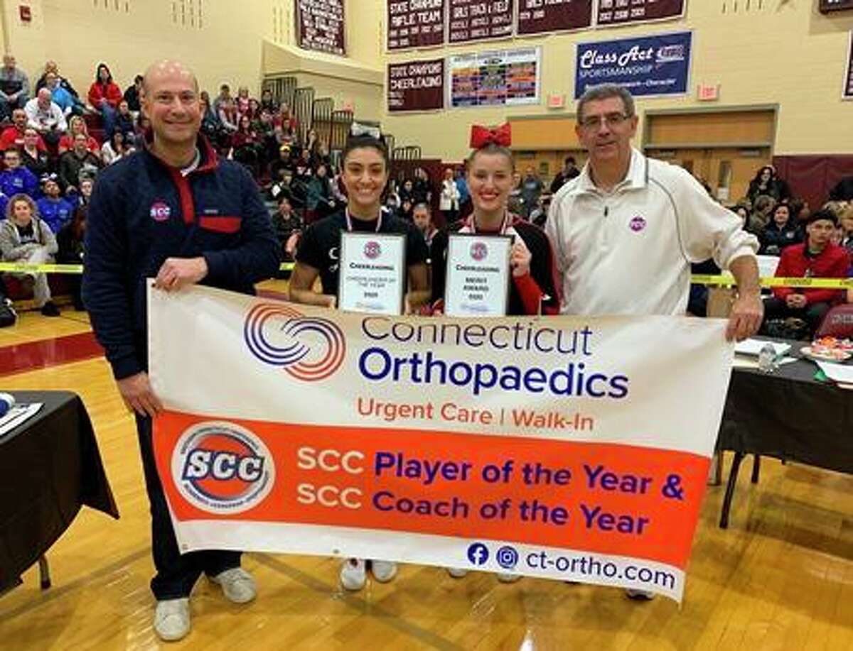 Connecticut Orthopaedics Urgent Care/SCC Cheerleader of the Year Trista Oddo from Shelton and Branford's Jade Smith, the SCC Coaches Merit Award winner, are flanked by SCC Commissioner Al Carbone and Shelton Athletic Director John Niski at the SCC cheerleading championship.