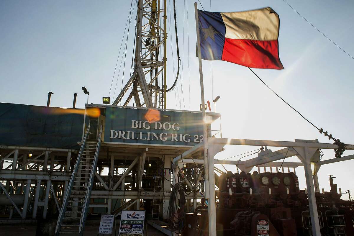 The Texas flag flies at Endeavor Energy Resources's Big Dog Drilling Rig 22 in the Permian basin outside of Midland in 2014.
