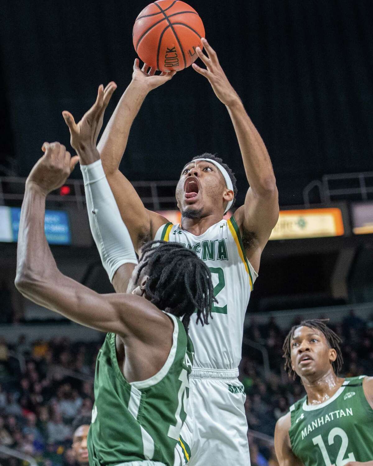 Siena College junior Jalen Pickett takes a jumper over Manhattan junior Michael during a Metro Atlantic Athletic Conference game at the Times Union Center in Albany, NY on Sunday, Feb. 16, 2020 (Jim Franco/Special to the Times Union.)