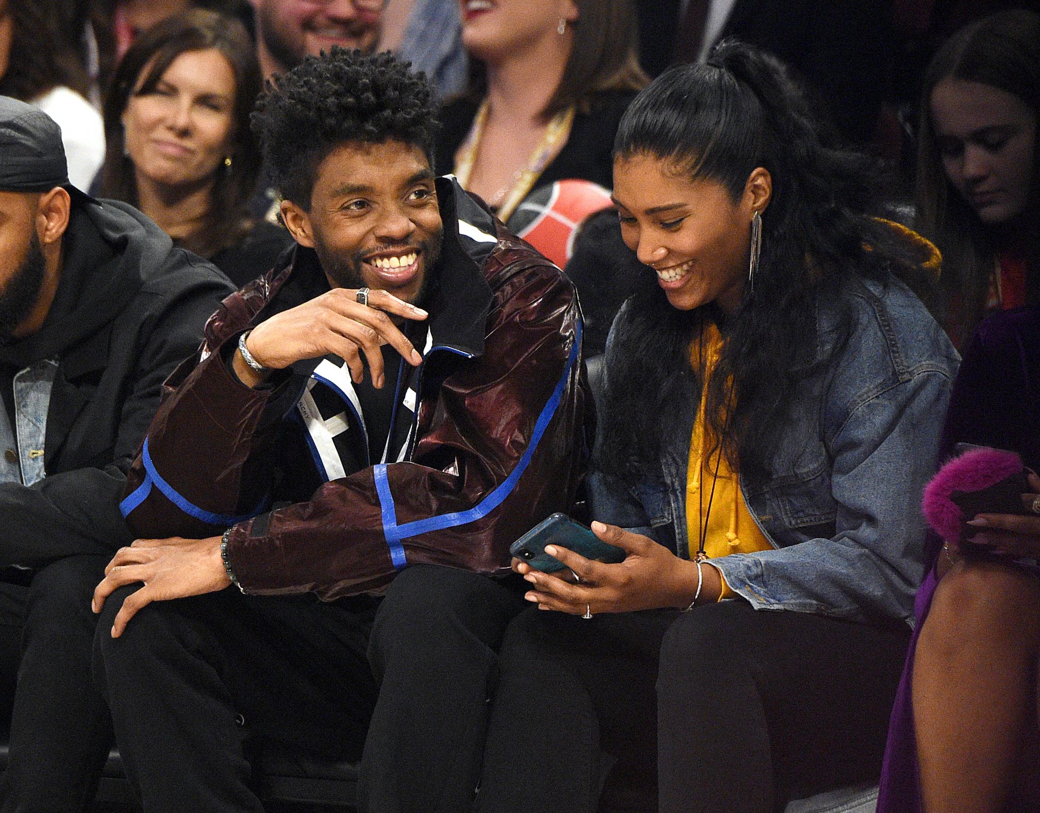 Celebrities sitting courtside at the NBA All-Star Game