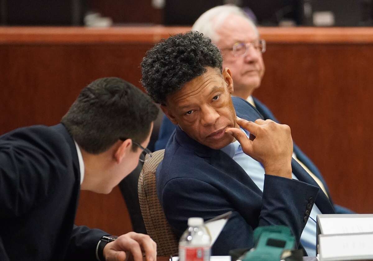 Lucky Ward, center, with his attorneys, Jimmy Ortiz, left, and Allen Isbell, right, during his death penalty trial Monday, Feb. 17, 2020 at the 183rd District Criminal Court in Houston. Ward is accused in the 2010 killings of a homeless woman, Reita Long, and a transgender woman identified in court records as Carlos Rodriguez.