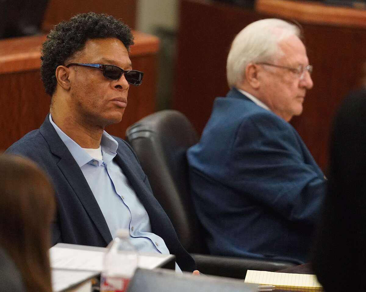 Lucky Ward, left, and his attorney Allen Isbell, right, during his death penalty trial Monday, Feb. 17, 2020 at the 183rd District Criminal Court in Houston. Ward is accused in the 2010 killings of a homeless woman, Reita Long, and a transgender woman identified in court records as Carlos Rodriguez.