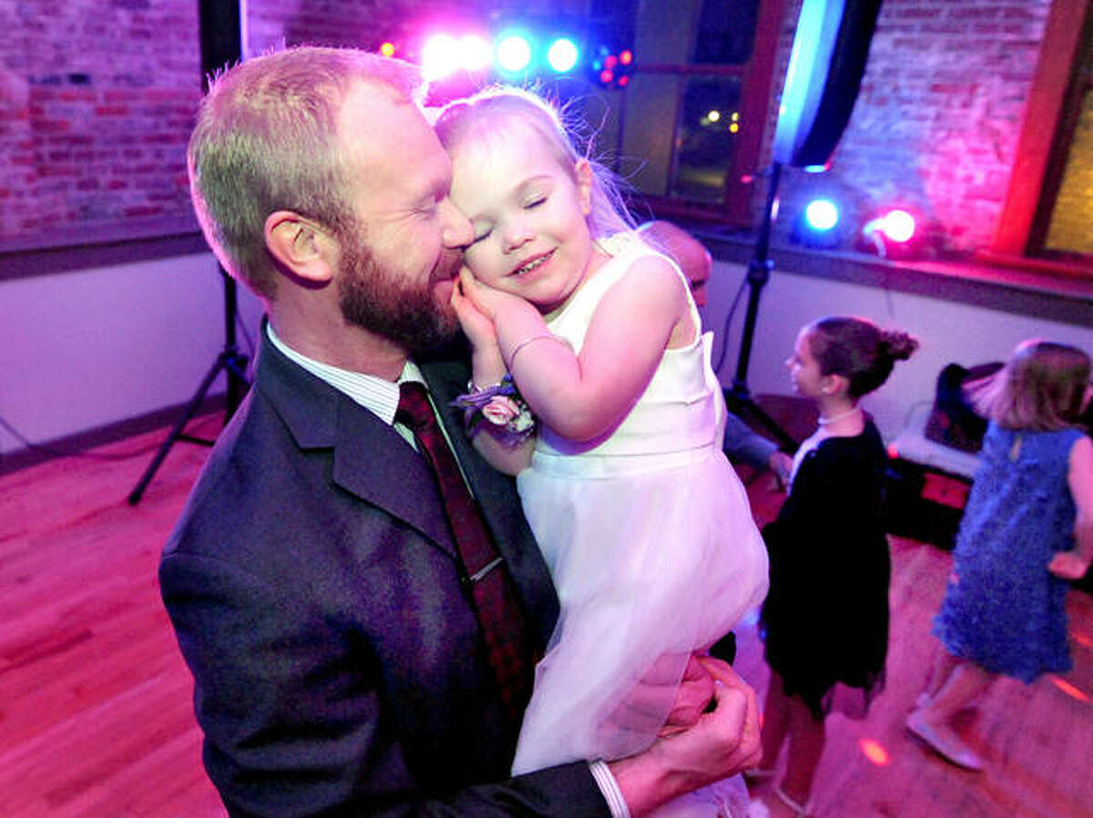 Brent Terveer, of Edwardsville, takes time to have a slow dance with his daughter Henley, 3, during the festivity, which was organized by the city’s parks and recreation department.