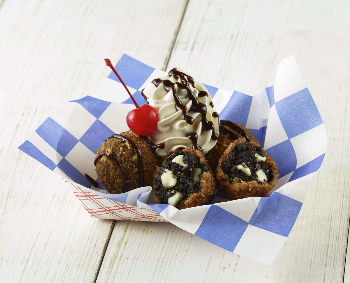 New to the 2020 Houston Livestock Show and Rodeo will be Black Gold Truffles made from crumbled chocolate cookies, cream cheese and mini white chocolate chips formed into balls that are coated with vanilla wafers, corn flakes and deep fried.