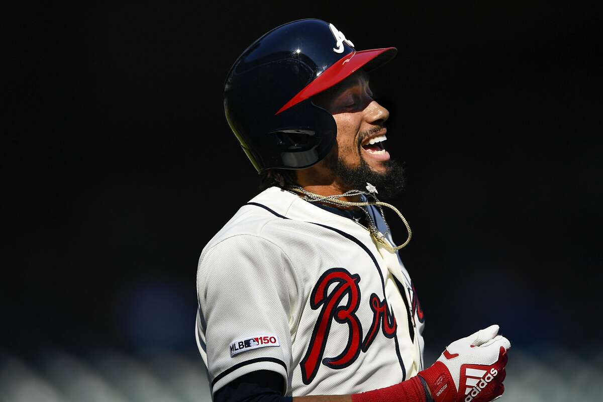 FILE - In this Sept. 8, 2019 file photo, Atlanta Braves' Billy Hamilton reacts after popping out to end a baseball game against the Washington Nationals in Atlanta. The San Francisco Giants believe they might be making a little major league history this spring: as the first team with uniform numbers 0 and 00 in the same year. When the Giants added Hamilton on a minor league deal earlier this month, equipment manager Brad Grems called the league to make sure there's a difference between the two, because new first base coach Antoan Richardson had claimed 00 already. (AP Photo/John Amis)