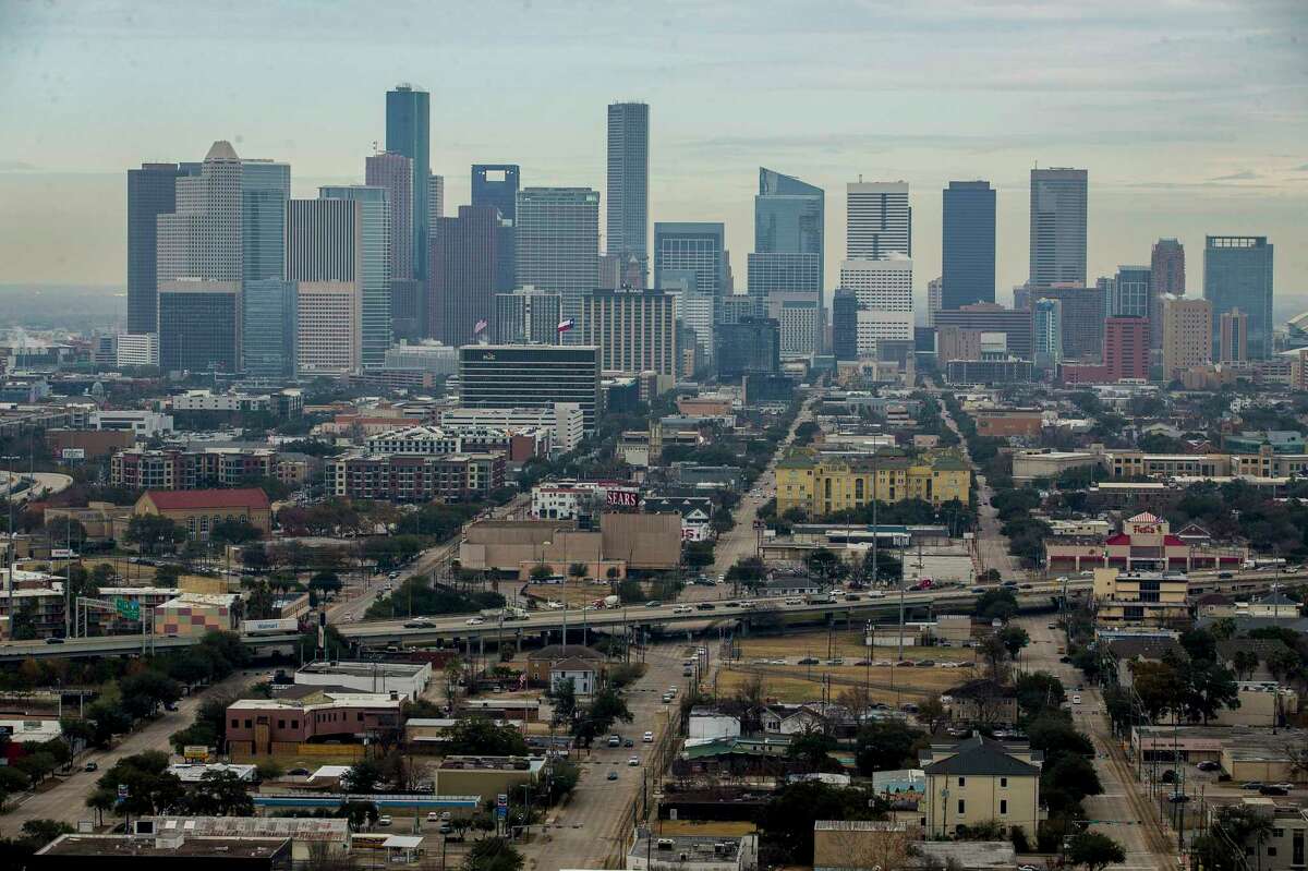 Midtown is seen from the south looking downtown from the Warwick Tower, Friday, Jan. 19, 2018, in Houston. The area, centered around the Sears building, is being redeveloped as part of an "innovation corridor" stretching from downtown through the medical center.