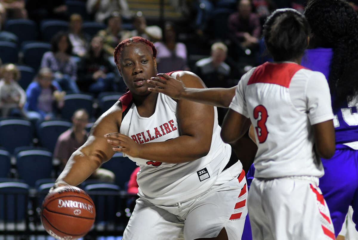 Bellaire senior center Jinaye Pittman, left, starts a fast break against Jersey Village during the 4th quarter of their Region III-6A UIL Girls Basketball Bi-District playoff matchup at Delmar Fieldhouse in Houston on Feb. 17, 2020.