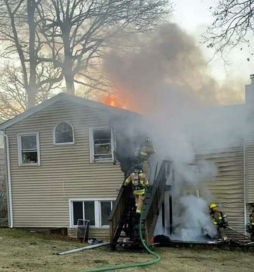 A house under renovation on Hampshire Drive was damaged by fire on Monday, Feb. 17, 2020. At 5:20 p.m., a call was received by the Stamford 911 center from a neighbor reporting flames coming from the rear of unoccupied house. Photo: Stamford Fire Department Photo