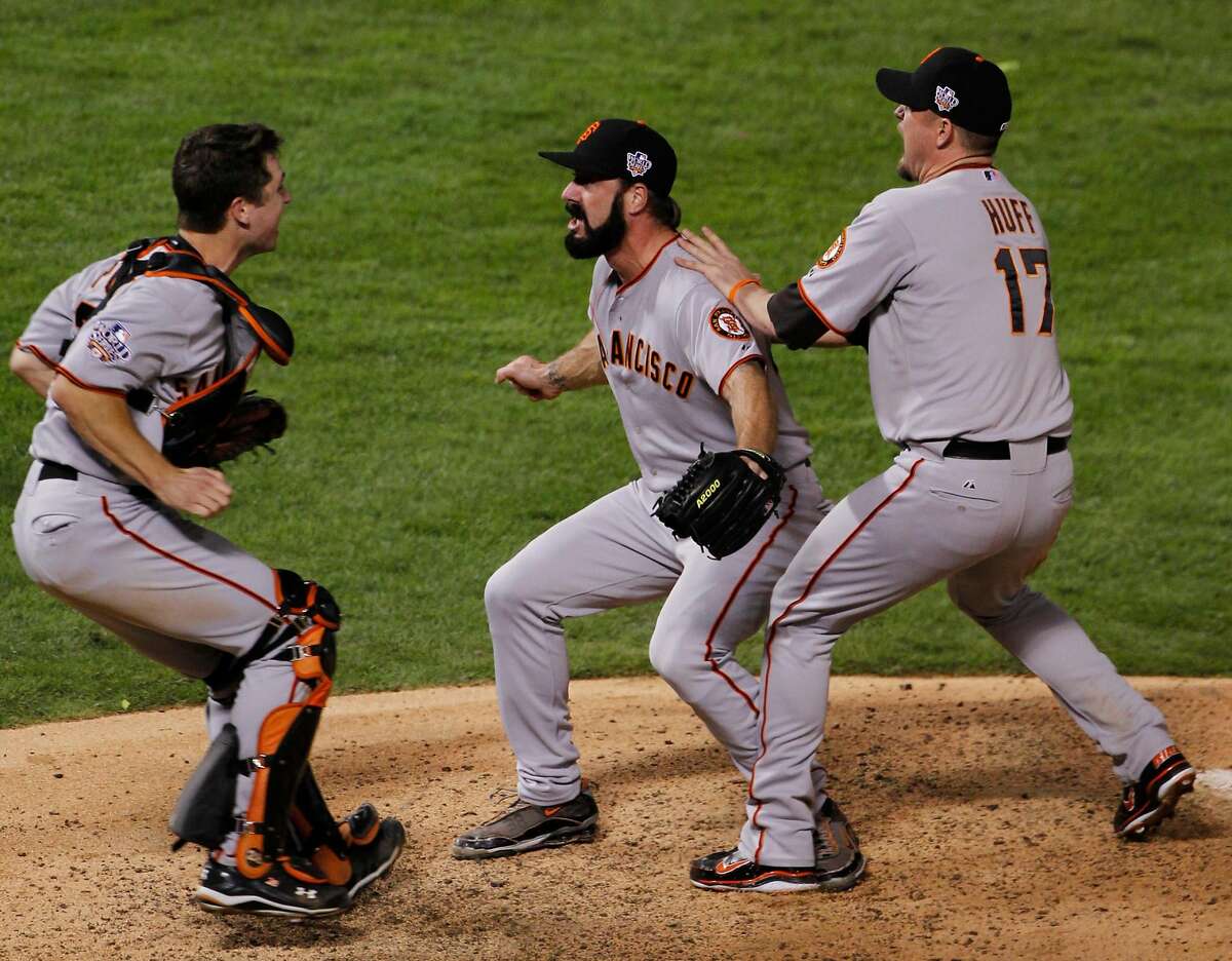 San Francisco Giants Brian Wilson celebrates with Buster Posey, left and Aubrey Huff, right after winning the World Series in Game 5 of baseball's World Series against the Texas Rangers Monday, Nov. 1, 2010, in Arlington, Texas. The Giants won 3-1 to capture the series.