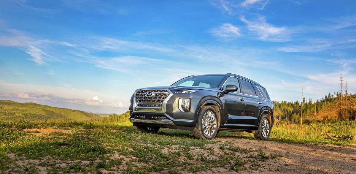 The 2020 Hyundai Palisade is a medium-priced SUV that can transport seven or eight passengers, depending on the configuration of the second-row seating. It boasts an impressive 18 cubic feet of luggage space behind the third-row seat, and is powered by a 291-horsepower V-6 engine.