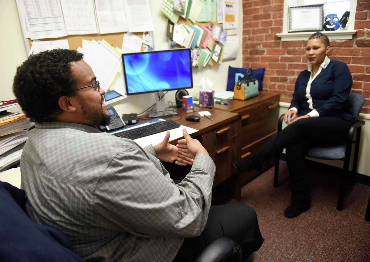 Family Centers Reaching Independence Through Employment (RITE) Program Coordinator Darian Jones chats with his client Mia Sambo, of Greenwich, in his office at Family Centers in Greenwich, Conn. Monday, Jan. 6, 2020. Sambo used the Family Centers RITE program to help land her dream job at an assisted living facility and start school full-time to become a social worker.