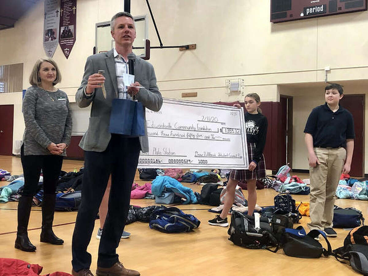 Alderman SJ Morrison speaks to St. Mary’s School students last week about the change they collected to donate to the Nickel Plate Depot. The students gave more than $1,300 to the depot’s campaign. The goal is $100,000.