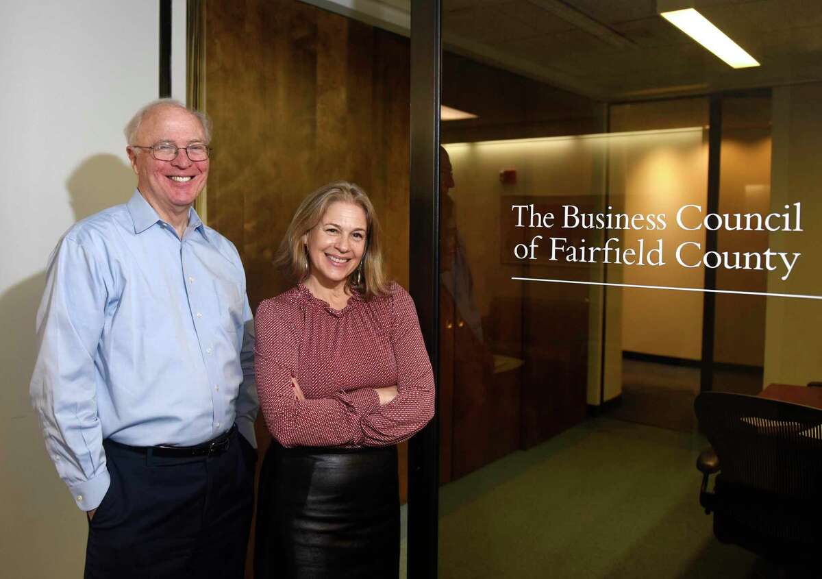 New President and CEO of the Business Council of Fairfield County Erin Flynn poses with predecessor Chris Bruhl at the Business Council of Fairfield County’s main offices at Landmark Square in downtown Stamford, Conn., on Feb. 6, 2020. Flynn took over the role of President and CEO from Bruhl, who retired at the end of January after 30 years in the position.