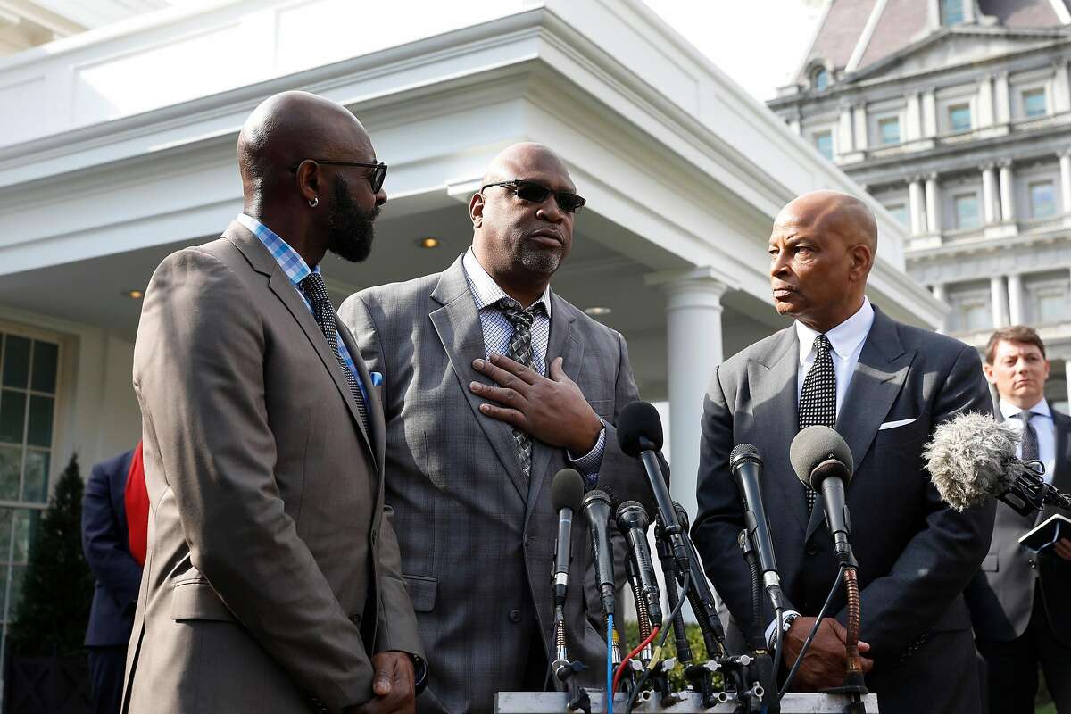 Former NFL football player Jerry Rice, from left, with other former NFL football players Charles Haley, and Ronnie Lott, speak to the media after U.S. President Donald Trump granted a full pardon to Edward DeBartolo Jr., former owner of the San Francisco 49ers, at the White House in Washington, D.C. on Tuesday, Feb. 18, 2020. (Yuri Gripas/Abaca Press/TNS)